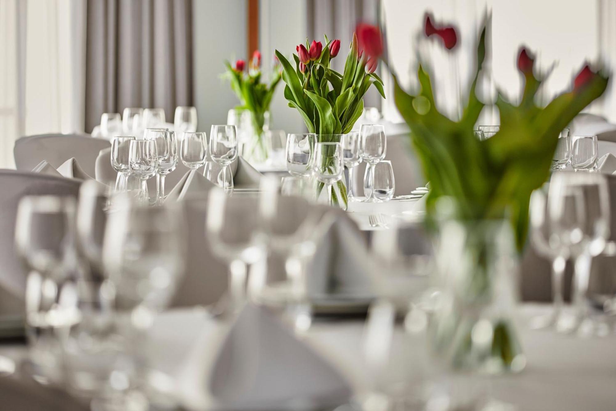 Sheraton Poznan Hotel Bagian luar foto A table set for a formal dinner