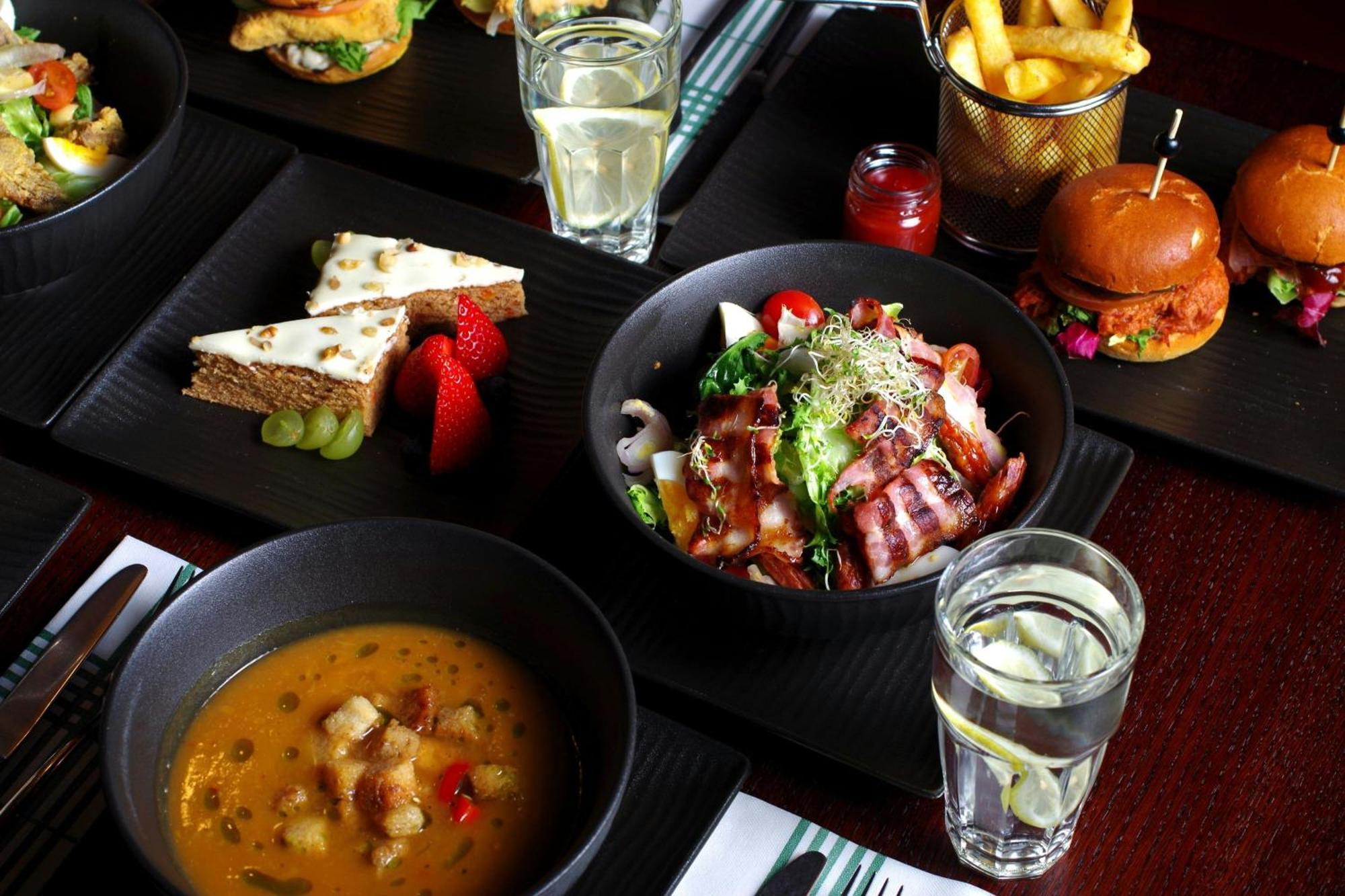 Sheraton Poznan Hotel Bagian luar foto A selection of dishes at the restaurant