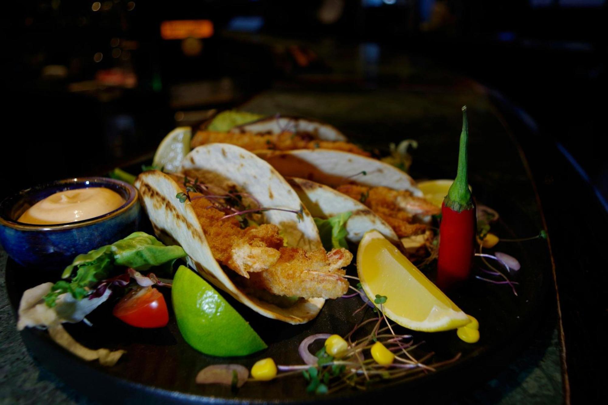 Sheraton Poznan Hotel Bagian luar foto A plate of grilled mussels